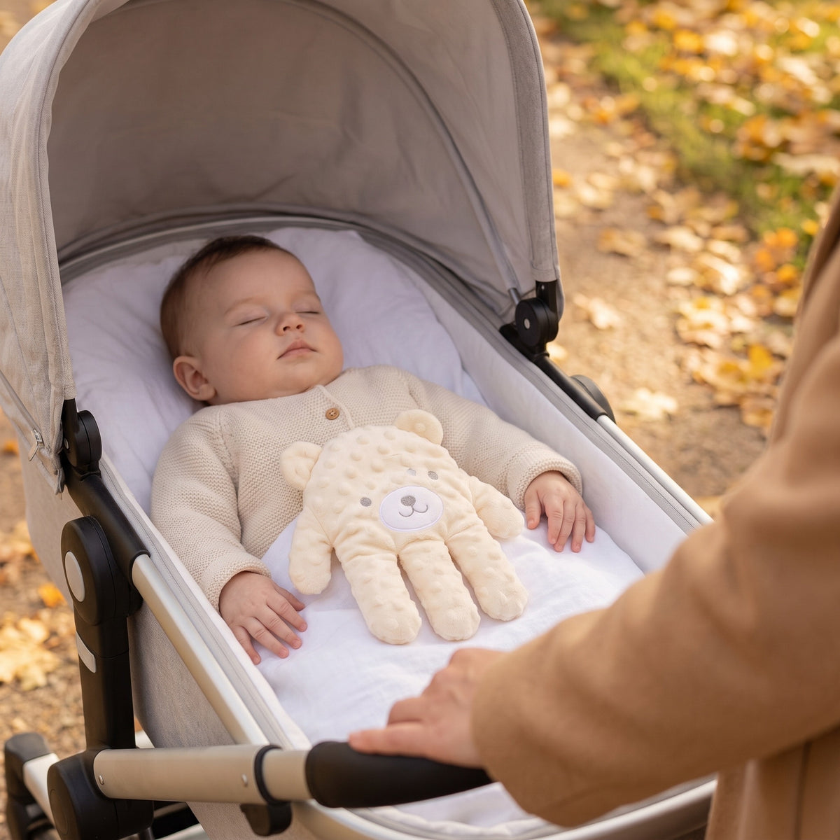 Baby Sleep Aid Patting Hand in use in a pram on a walk